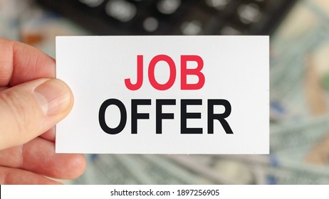 Motivational Words: JOB OFFER. Man Holds A Piece Of Paper With The Text: JOB OFFER. Business And Finance Concept