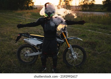 Motocross Biker Exhales Steam At Sunset