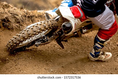 Motocross Racer Accelerating In Dirt Track