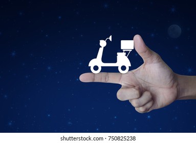 Motor Bike Icon On Finger Over Fantasy Night Sky And Moon, Business Delivery Service Concept