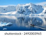 Motor boat cruising through Antarctica