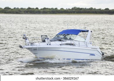 Motor Boat Floats On The River