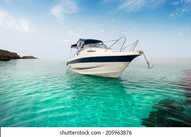 Motor boat on the beach. - Powered by Shutterstock