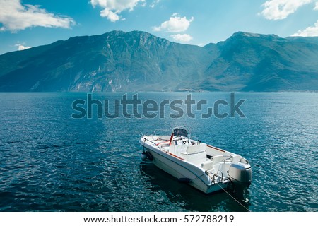 Motor boat on beautiful Garda lake, Italy. Vacation background