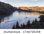 Motor boat on the beautiful lake at sunset. Billy Chinook lake in Oregon, USA, The Cove Palisades State park