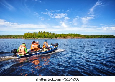 Motor Boat With People On A Lake