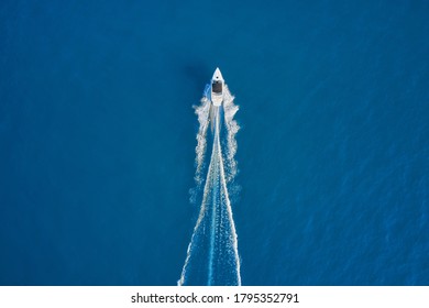 Motor Boat In The Sea. Aerial View Luxury Motor Boat. Drone View Of A Boat Sailing. Travel - Image. Top View Of A White Boat Sailing To The Blue Sea.