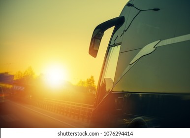 Motor Coach Bus On The Route During Scenic Sunset. Bus Transportation.