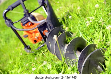 Motor Earth Auger On The Grass