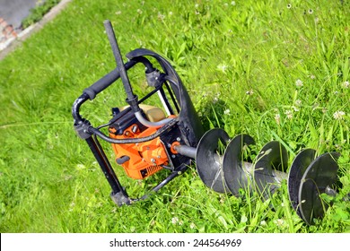 Motor Earth Auger On The Grass