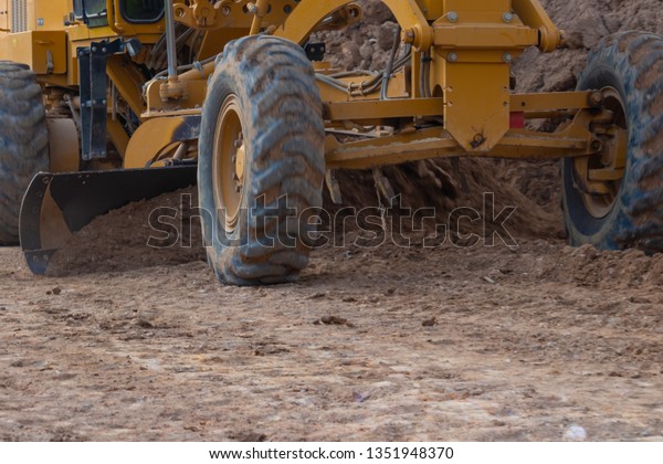 \
Motor Grader in road\
construction,\
Machinery in road\
construction