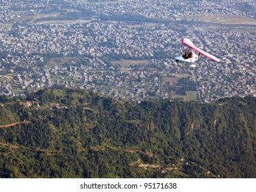 Motor Hang-gliding In Flight Over The City Of Pokhara - Nepal, Himalaya