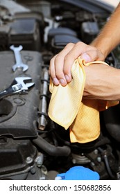 Motor Mechanic Cleaning His Greasy Hands After Servicing Car