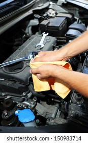 Motor Mechanic Cleaning His Greasy Hands After Servicing Car