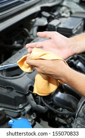 Motor Mechanic Cleaning His Greasy Hands After Servicing Car 