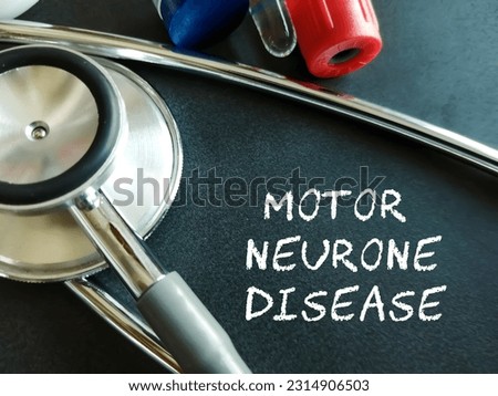 Motor Neurone Disease (MND) term isolated on black background with medical tools. Amyotrophic lateral sclerosis (ALS)