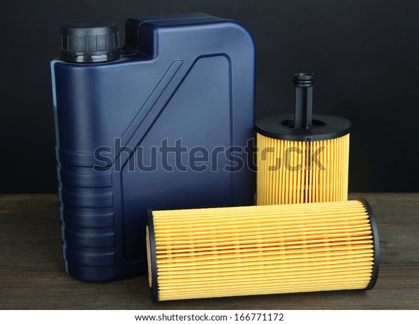 Motor oil canister on\
grey background