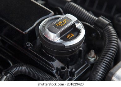 Motor Oil Cap Under The Hood Of A Car