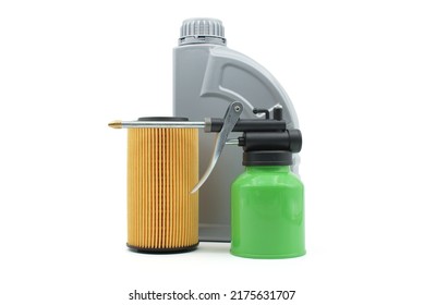 Motor oil, hand oiler and oil filters isolated on a white background. Car servicing, automotive industry or oil and filter replacing maintenance
