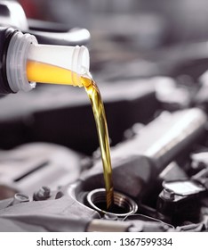 Motor Oil Pouring To Car Engine.