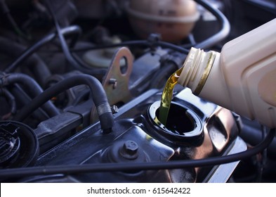 Motor oil pouring to car engine. Crude oil prices and gas price. Oil Prices Move Higher, business concept.
