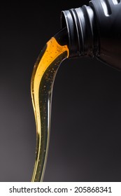 Motor Oil Pouring Over Black Background