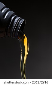 Motor Oil Pouring Over Black Background