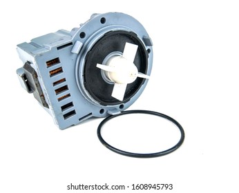 Motor pump with impeller of a washing machine on a white background. Repair of washing machines. Repair of dishwashers. The spare part. Appliances. Place for text.