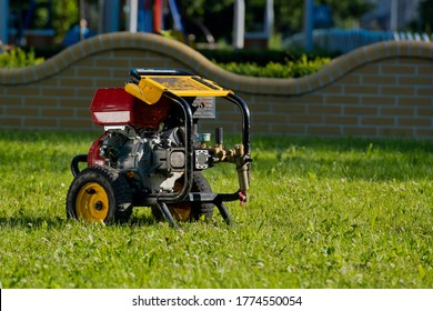 Motor pump on the lawn. - Shutterstock ID 1774550054