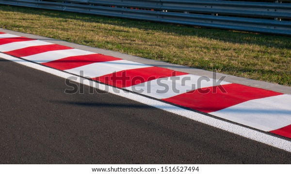Motor racing circuit\
Red and White Kerb