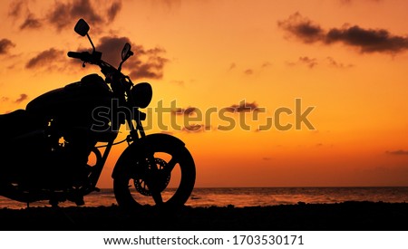  Motor silhouette at sunset time near sea coast line