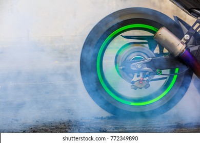Motorbike burnout, Biker on a motorcycle drifts in smoke, burns tire on a motorcycle.