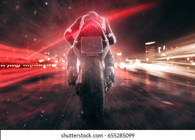 Motorbike Drives Through Night City