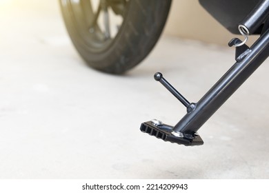 Motorbike foot side stand with wheel background