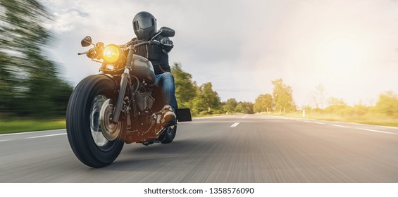 motorbike on the forest road riding. having fun driving the empty road on a motorcycle tour journey. copyspace for your individual text.  - Shutterstock ID 1358576090