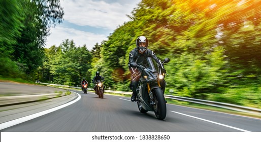 motorbike on the road riding. having fun driving the empty road on a motorcycle tour journey. copyspace for your individual text. Fast Motion Blur effect