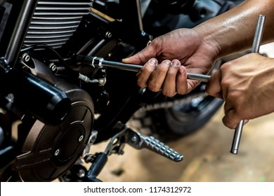 Motorbike Repair Service Motorcycle Use Wrench. motorbike is repairing maintenance Use a wrench and a screwdriver to work. - Powered by Shutterstock