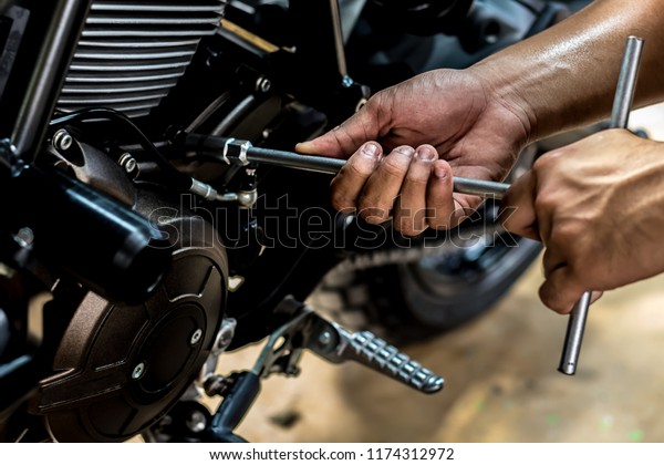 Motorbike Repair Service Motorcycle Use Wrench.\
motorbike is repairing maintenance Use a wrench and a screwdriver\
to work.