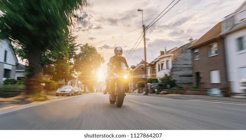 Motorbike Riding At A City Road. Driving On Road On A Motorcycle Tour