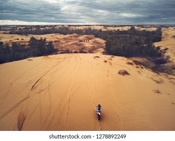 Motorbikes In Desert. Motorcycle Riding In Wilderness Aerial View. Extreme Motorcycling In Wild Nature