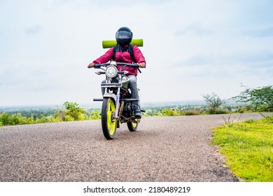 motorbke Rider with backpack traveling on motorbike near mountains on road - concept of freedom, weekend holidays and outdoor activities - Shutterstock ID 2180489219