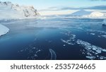 Motorboat in the Southern Ocean, Antarctica. Little boat in the big Ocean. Track from the boat in the frozen ocean. Drone view