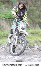 Motorcross Driver Woman Road In Forest. Dirt Motocross Bike Rider Woman. Osaka Japan. March 28, 2021