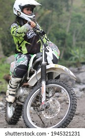 Motorcross Driver Woman Road In Forest. Dirt Motocross Bike Rider Woman. Osaka Japan. March 28, 2021