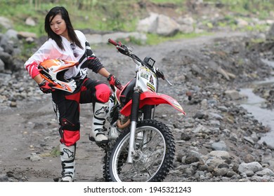 Motorcross Driver Woman Road In Forest. Dirt Motocross Bike Rider Woman. Osaka Japan. March 28, 2021