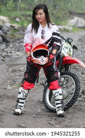 Motorcross Driver Woman Road In Forest. Dirt Motocross Bike Rider Woman. Osaka Japan. March 28, 2021