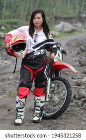 Motorcross Driver Woman Road In Forest. Dirt Motocross Bike Rider Woman. Osaka Japan. March 28, 2021