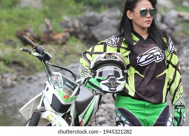 Motorcross Driver Woman Road In Forest. Dirt Motocross Bike Rider Woman. Osaka Japan. March 28, 2021