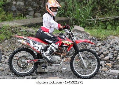 Motorcross Driver Woman Road In Forest. Dirt Motocross Bike Rider Woman. Osaka Japan. March 28, 2021