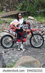 Motorcross Driver Woman Road In Forest. Dirt Motocross Bike Rider Woman. Osaka Japan. March 28, 2021